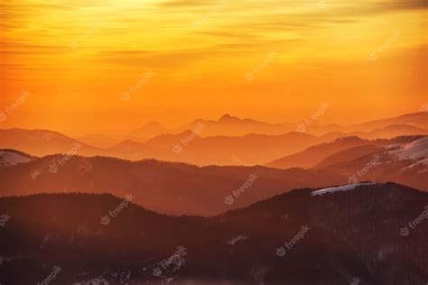 Premium Photo | Sunset in dramatic winter mountains