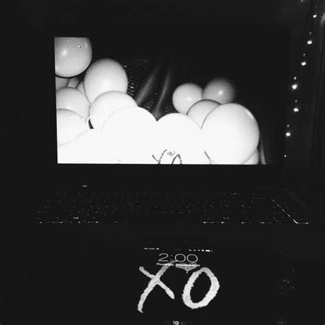 An Open Laptop Computer Sitting On Top Of A Table With Eggs In Front Of It