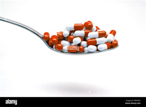 dosage of capsules red and white Stock Photo - Alamy