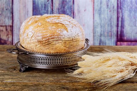 Premium Photo Freshly Baked Traditional Bread On Wooden Table