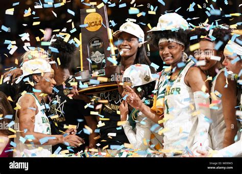 The Baylor Lady Bears Celebrate With The Championship Trophy After