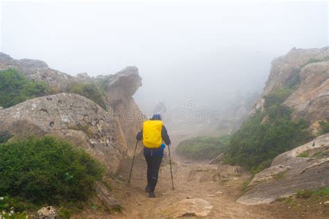 Backpackers On Foggy Trekking Path In Annapurna Conservation Area