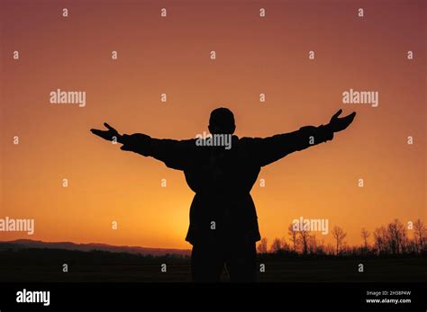 Silhouette Man Standing Arms Outstretched Hi Res Stock Photography And