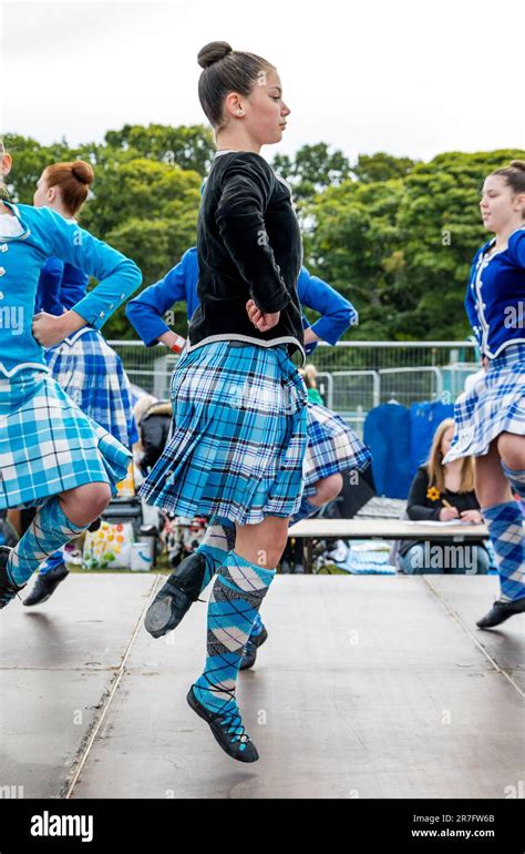 Girls Competing In Highland Dancing Event Wearing Traditional Kilts