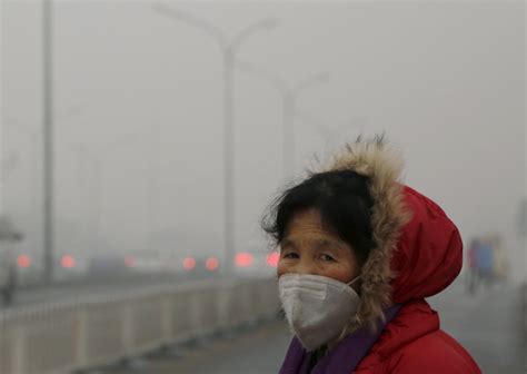 PHOTOS: Smog smothers Beijing in city’s first-ever pollution red alert