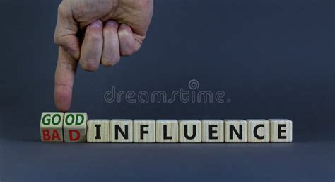 Good Or Bad Influence Symbol Businessman Turns Cubes And Changes Words