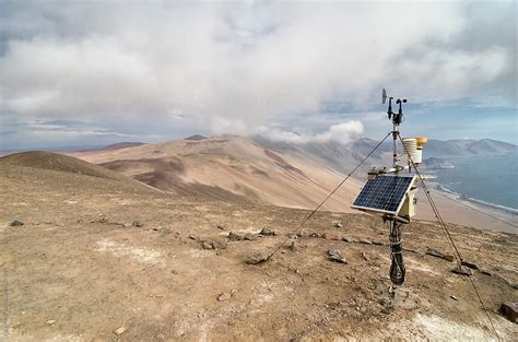 "Solar Panel At The Cliff In Desert, Ocean Below And Cloud Above" by Stocksy Contributor "Alice ...