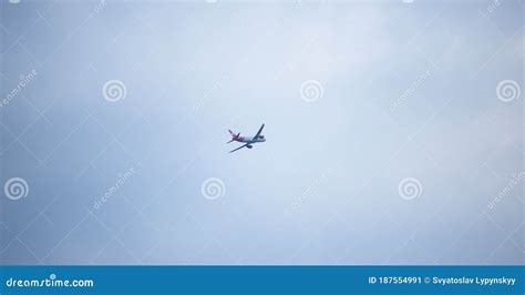 Plane Flying High In Blue Sky White Plane With A Red Tail April 2013