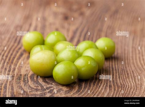 Raw Cherry Prunes On Wood Stock Photo Alamy