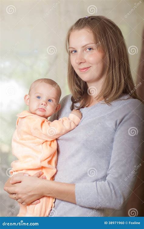 Young Mother Holding A Baby Stock Photo Image Of Happiness Home