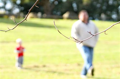 My Partner And Son Taking A Leisurely Stroll Through A Local Park