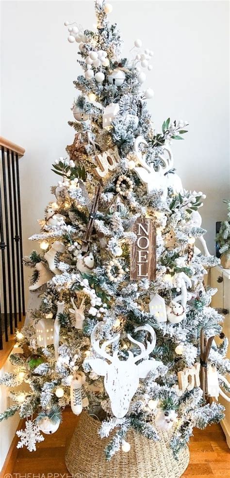 White Flocked Christmas Tree With Neutral Wood Accents | The Happy ...