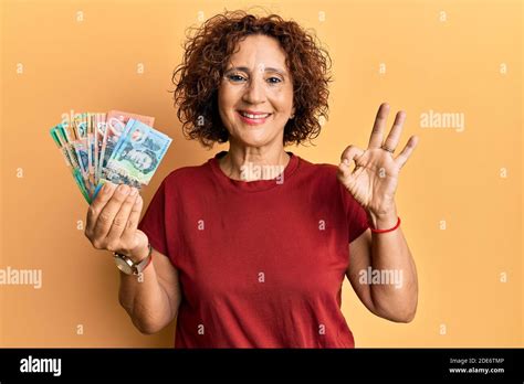 Beautiful Middle Age Mature Woman Holding Australian Dollars Doing Ok