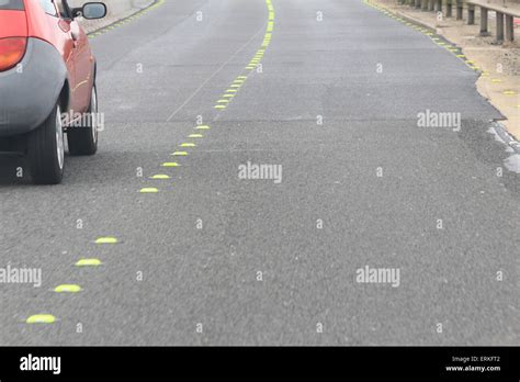 A Car And Road Work Cats Eyes On The Motorway Stock Photo Royalty Free