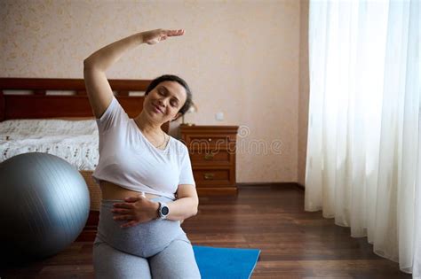 Happy Pregnant Woman Touches Her Belly On Late Pregnancy Practices