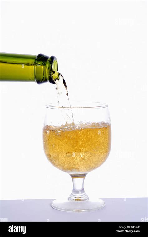 Pouring Cider Into A Glass Stock Photo Alamy