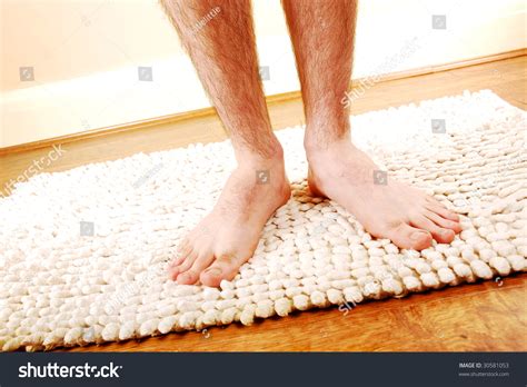 A Man S Naked Legs And Feet Standing On A Bath Mat Stock Photo Shutterstock