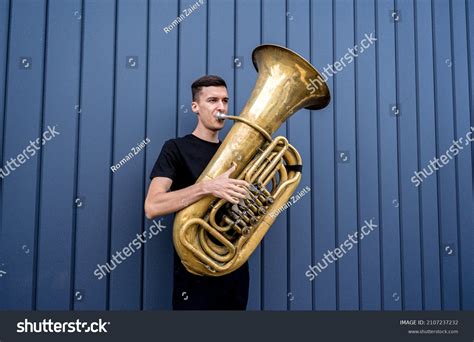 Young Street Musician Playing Tuba Near Stock Photo 2107237232