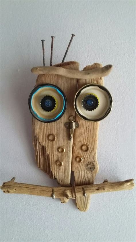 An Owl Made Out Of Wood With Two Eyes