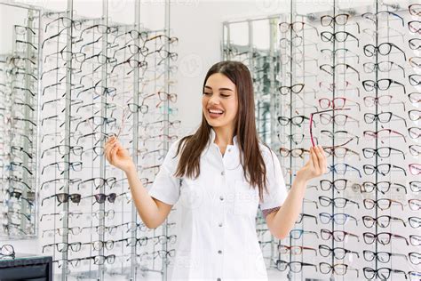 Attractive young female doctor in ophthalmology clinic. Doctor