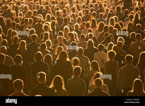 anonymous crowd  people standing  mass event stock photo