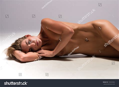 Beautiful Sunburned Brunette Nude On Gray Stock Photo 194535965 Shutterstock