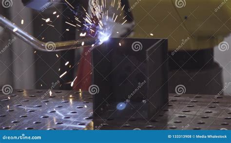 Industrial Robotic Arm for Welding. Welding Robot Machine Automotive Industry Stock Photo ...