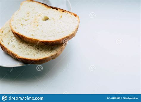 Two Slices Of White Bread On A Plate Stock Photo Image Of Cooked