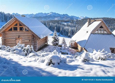 Wooden Houses in Snowy Mountains on Bright Winter Day. Snow and Frost ...