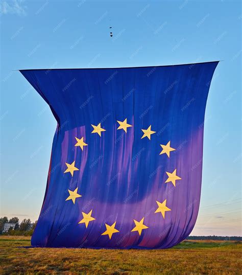 Premium Photo | Rise in the sky the biggest flag of the european union