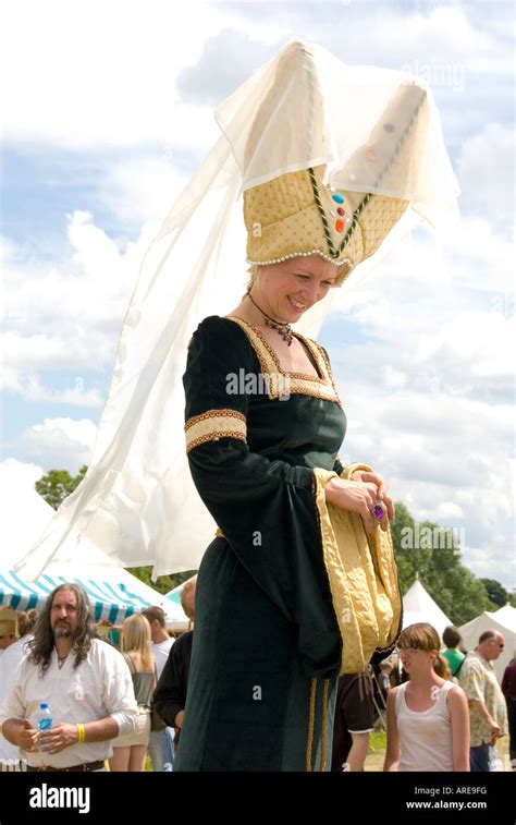 Medieval Maiden Woman In Two Pronged Hat Veil And Green Gold Dress