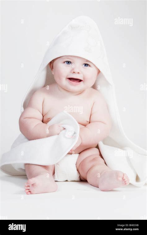 A colour color photograph of a white Caucasian male baby aged seven ...