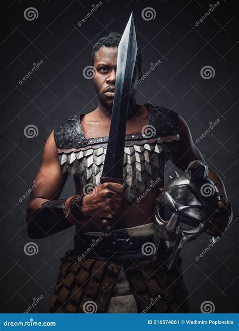 Studio Shot Of Antique Roman Gladiator Of African Ethnic With Sword