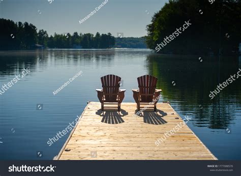 Two Adirondack Chairs On Wooden Dock Stock Photo 1777088570 Shutterstock