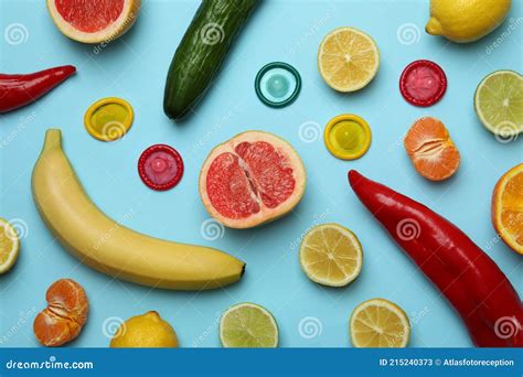 Sex Concept With Fruits And Condoms On Blue Background Stock Image