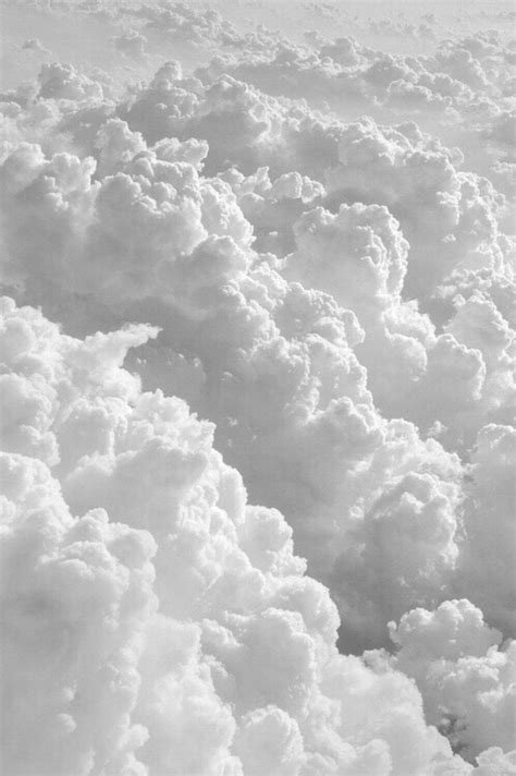 Download a black and white photo of clouds above the ground Wallpaper | Wallpapers.com