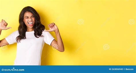 Portrait Of Confident And Happy African American Woman Pointing Fingers At Herself Proudly