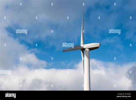 Isolated Silhouette Of Windturbine Energy Generator On Blue And Cloudy