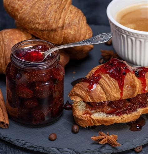 Premium Photo Baked Croissant With Strawberry Jam