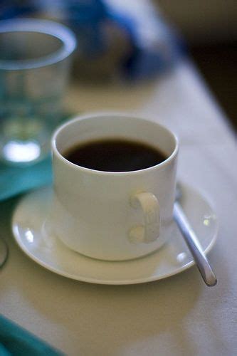 A Cup Of Coffee Sitting On Top Of A White Saucer