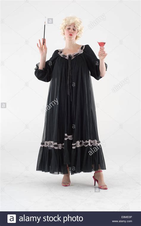 woman in fancy dress comedy costume in 1960s fashion and crazy funny outfit Stock Photo - Alamy