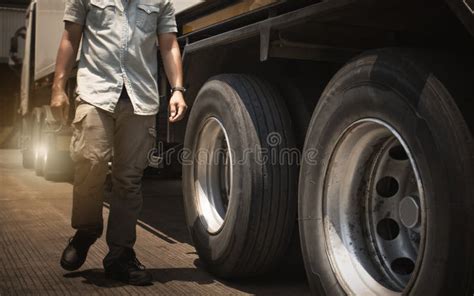 Truck Drivers Walking And Checking The Semi Truck S Maintenance Truck