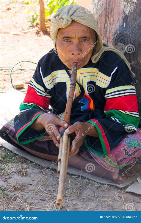 Lahu Hilltribe Woman Playing A Wind Instrument In Chiang Rai Province