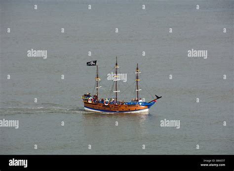 Pirate Themed Tourist Passenger Boat Flying A Black Jolly Roger Flag