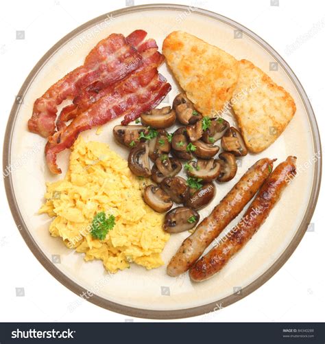 Cooked Breakfast With Scrambled Eggs Bacon Sausages Mushrooms And