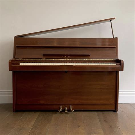 A Yamaha Upright Piano, Mahogany Satin Gloss