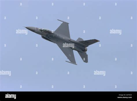 An F 16 Fighting Falcon Flying In A Tight Turn Amidst Blue Sky And