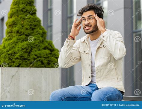 Displeased Sick Indian Man Rubbing Temples To Cure Headache Problem