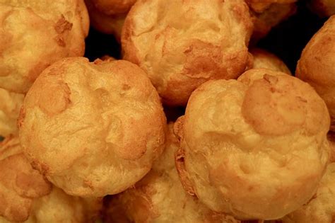 Premium Photo Heap Of Fresh Baked French Choux Pastry Balls During