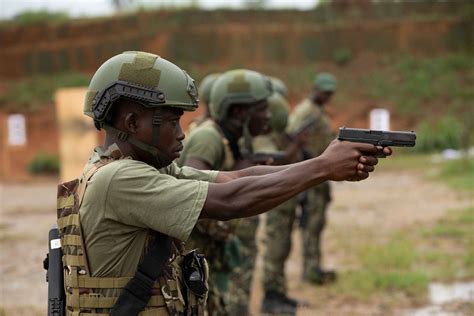 A Côte D Ivoire Special Forces Soldier fires his pistol NARA DVIDS